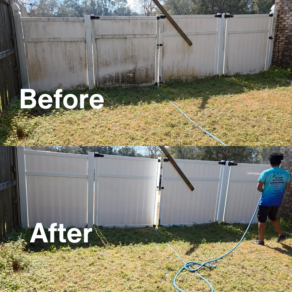 Before and after pressure washing of a white vinyl fence in Pensacola, FL